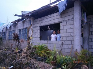 Rev. Mabini Balgos walking in a ghost town in Medellin, Cebu. The parsonage of their church was heavily hit by typhoon Yolanda. Pls. pray for him.